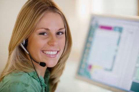 Woman smiling wearing a headset